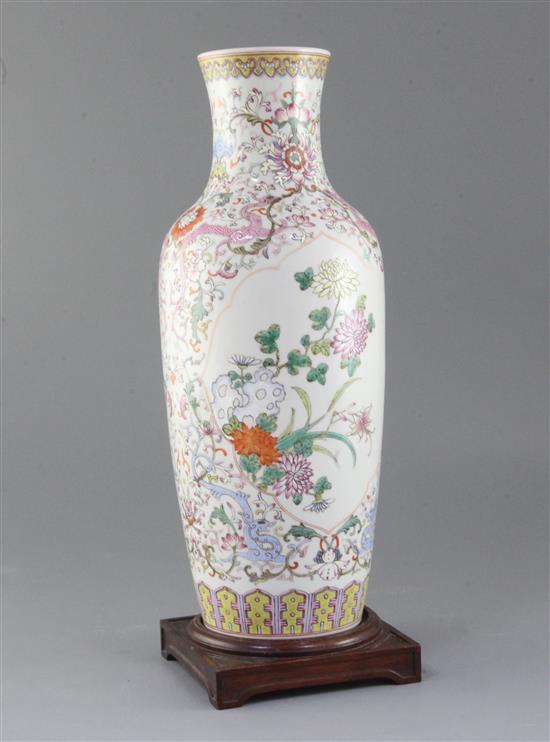 A Chinese famille rose baluster vase, height 37.5cm, wood stand